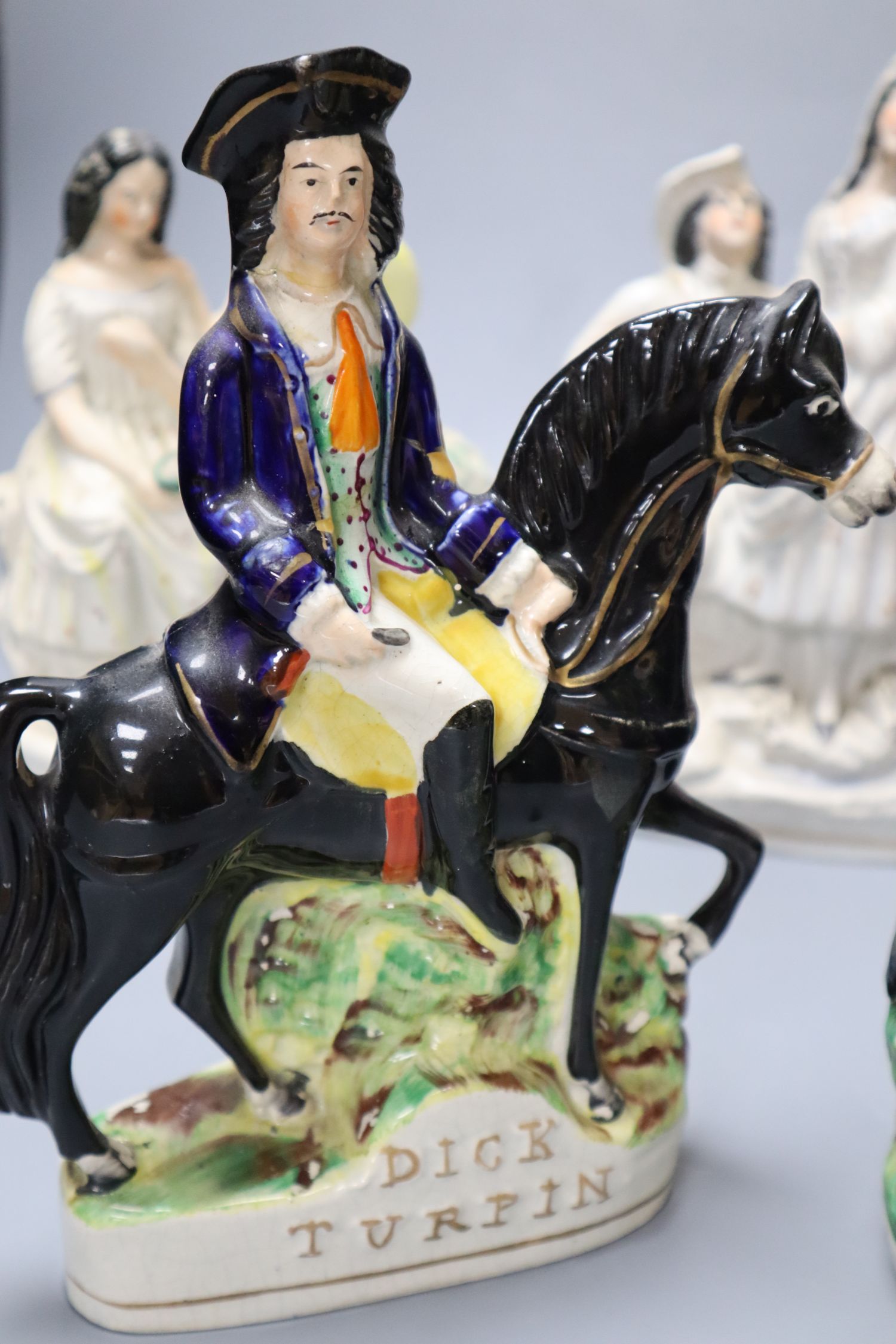 Five 19th century Staffordshire pottery figures including Dick Turpin, later 24cm